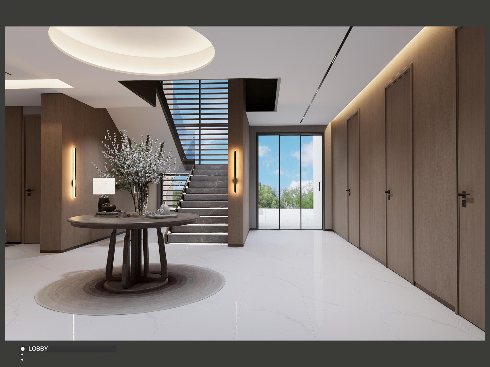 Villa entry hall with wood panelling and feature staircase