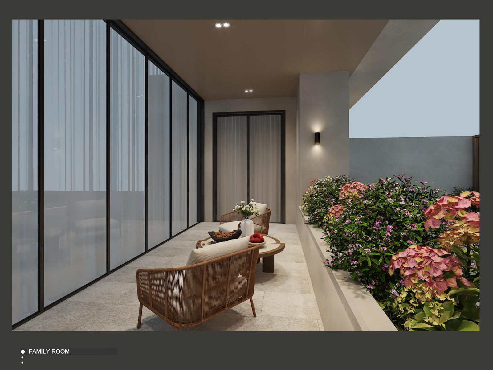 Second family room with a light sofa and views through full-height glazing