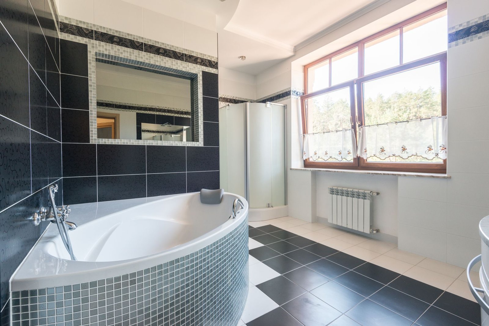 dark porcelain floor tile in a villa bathroom with bathtub