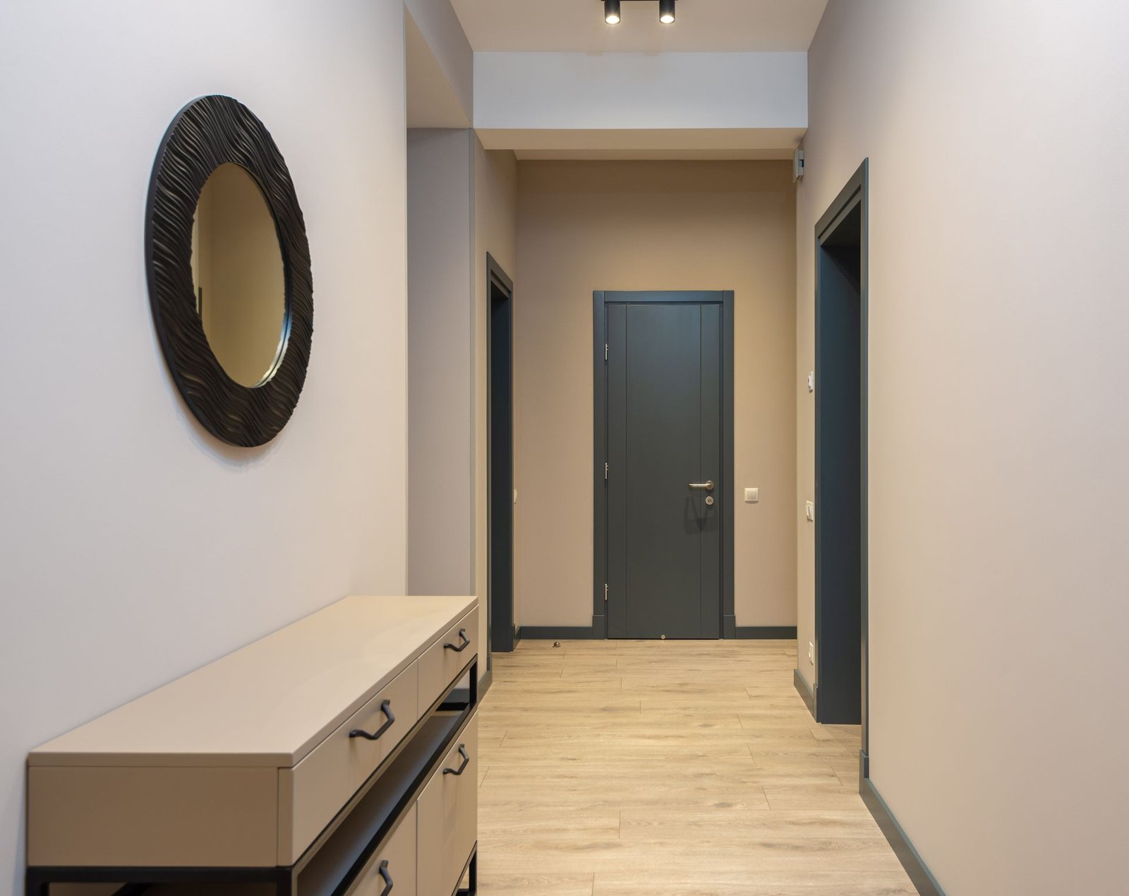 oak-look vinyl flooring in a villa entryway with console