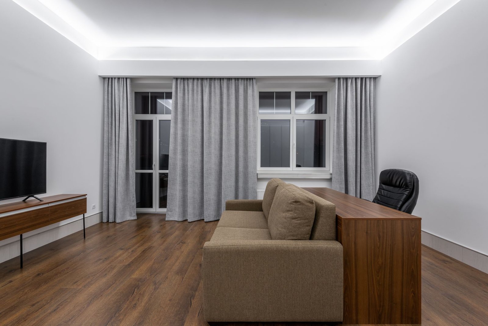 dark walnut-look SPC flooring in a villa media room