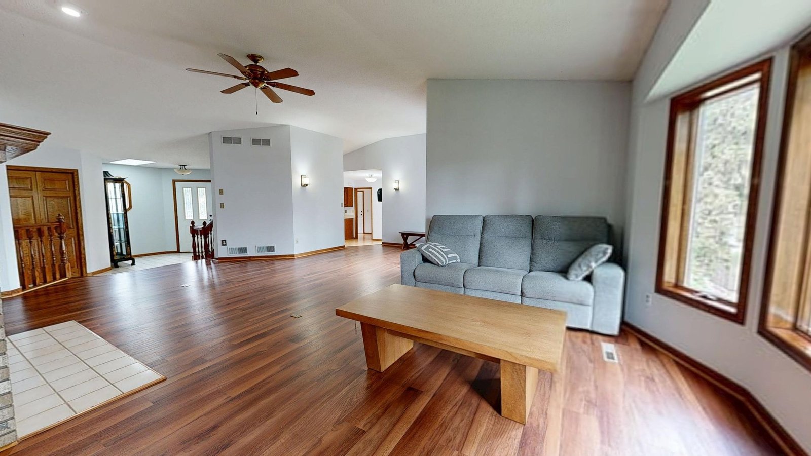 warm walnut-tone engineered flooring in a villa living room