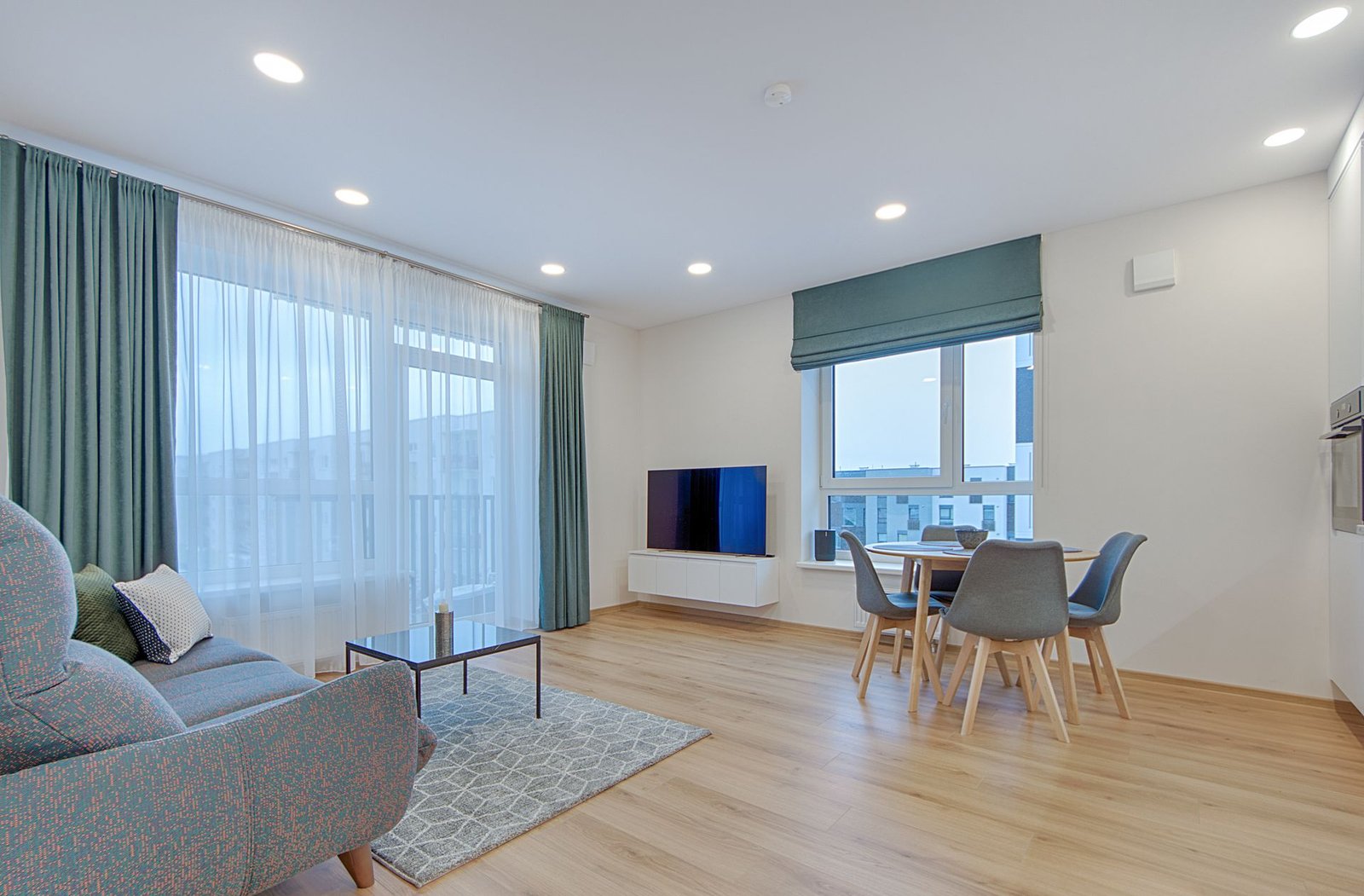 light engineered flooring under a modern villa dining and living space