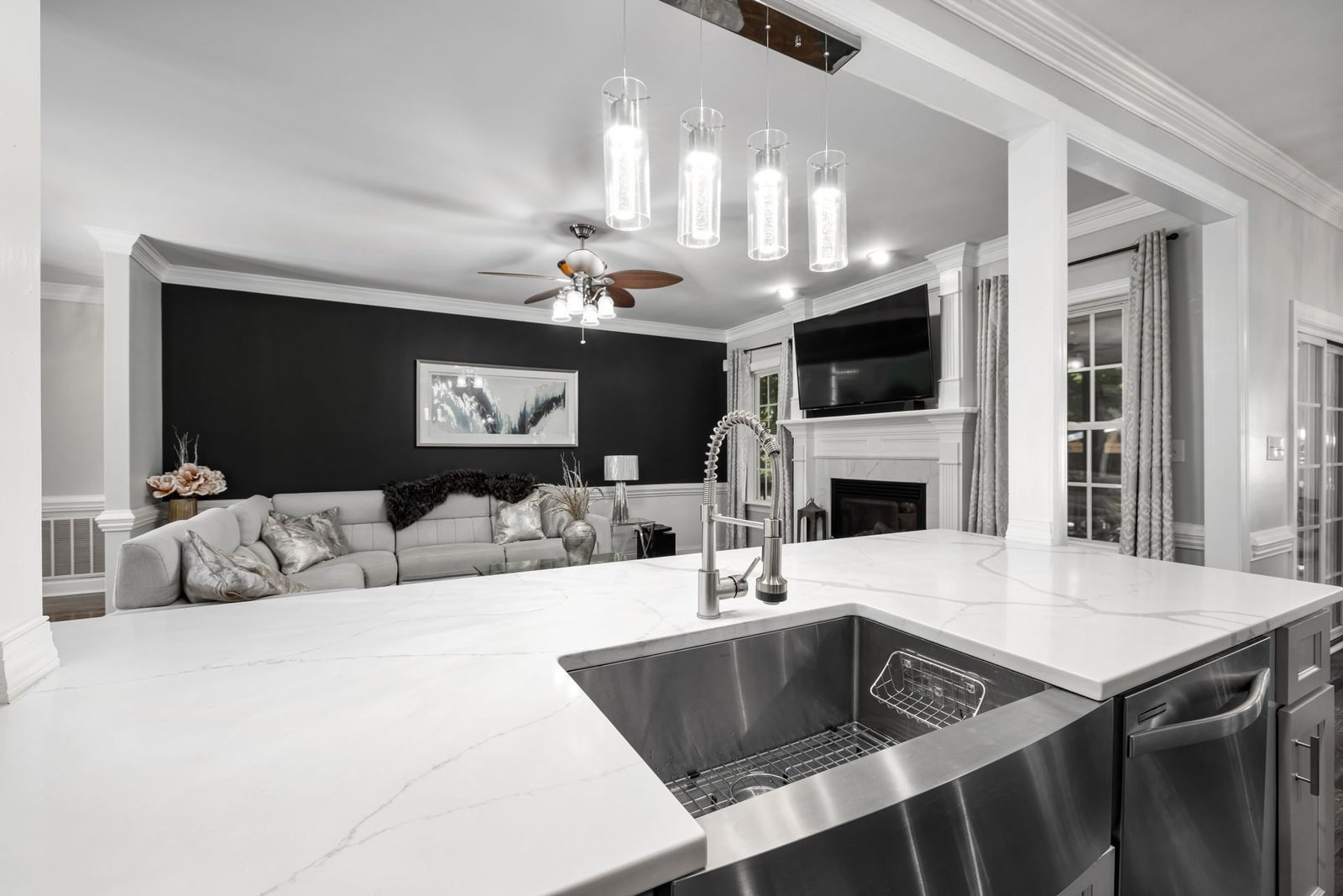 White quartz kitchen island with breakfast bar in a new-build villa kitchen