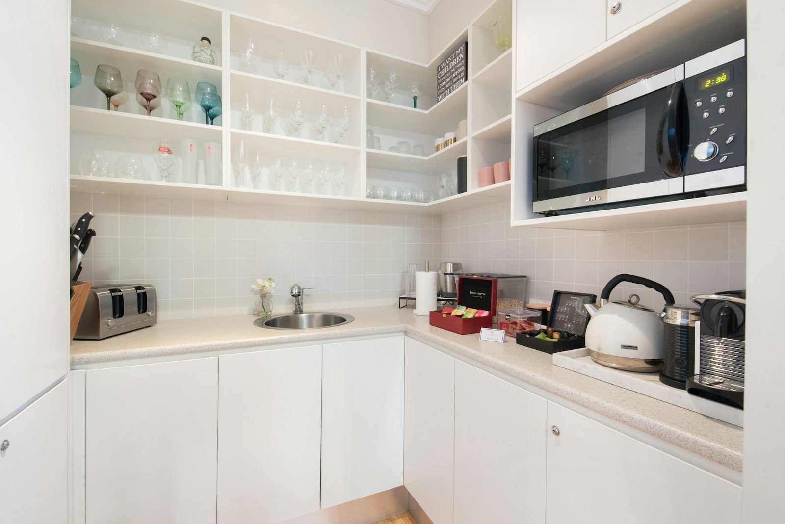Compact pantry nook with open glassware shelving