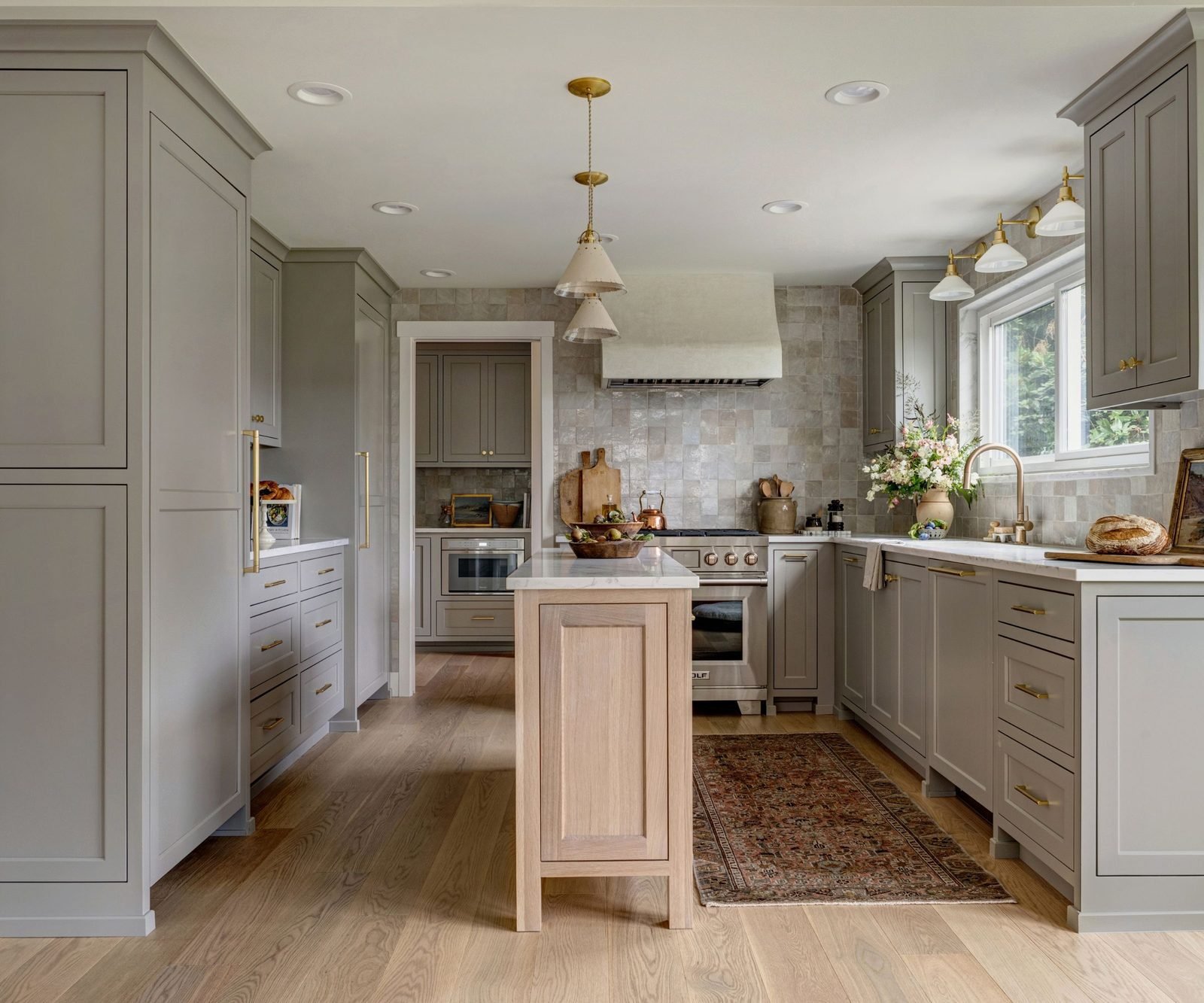 Full grey shaker kitchen layout with tall units