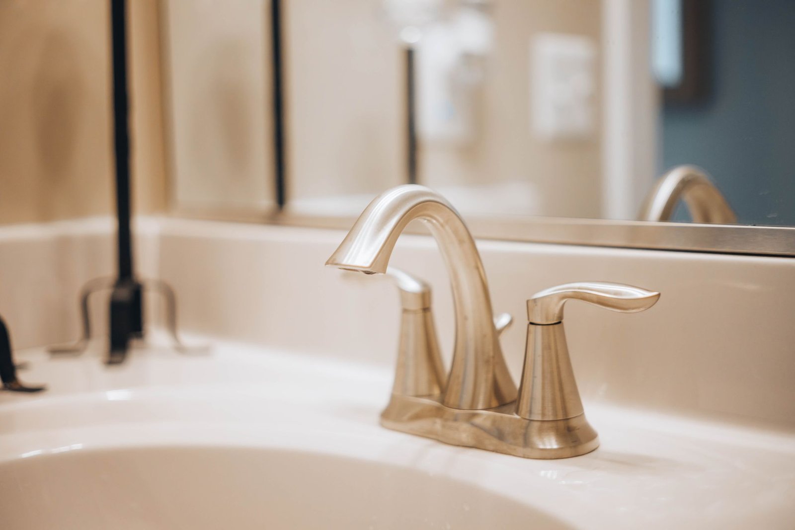 Gold basin tap close-up with cross handles