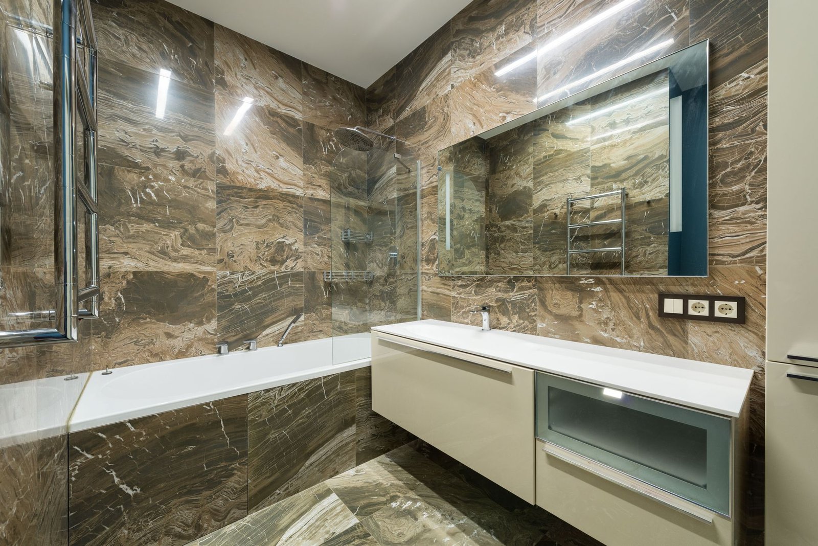 Warm brown marble field with long white vanity
