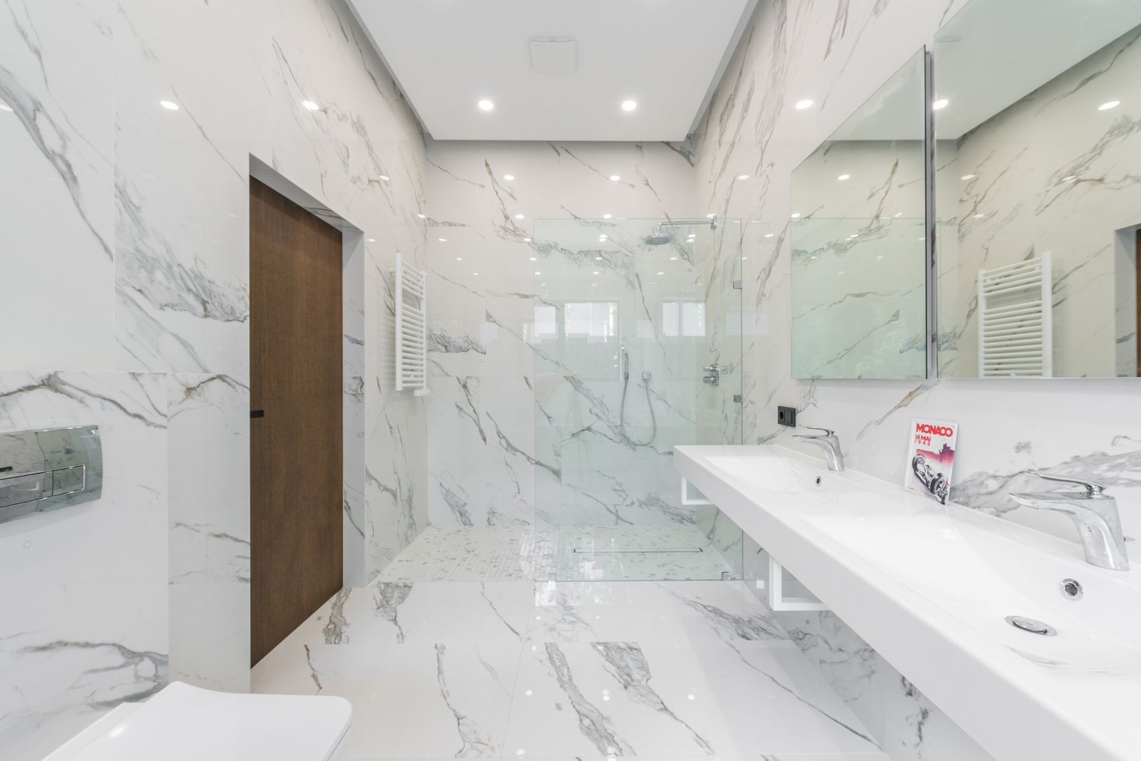 White marble wet area with timber door