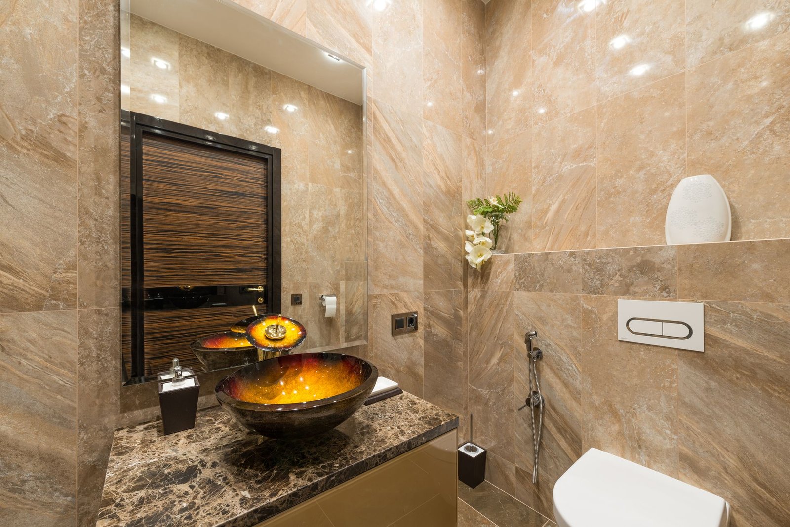 Gold-beige marble wall with vessel basin