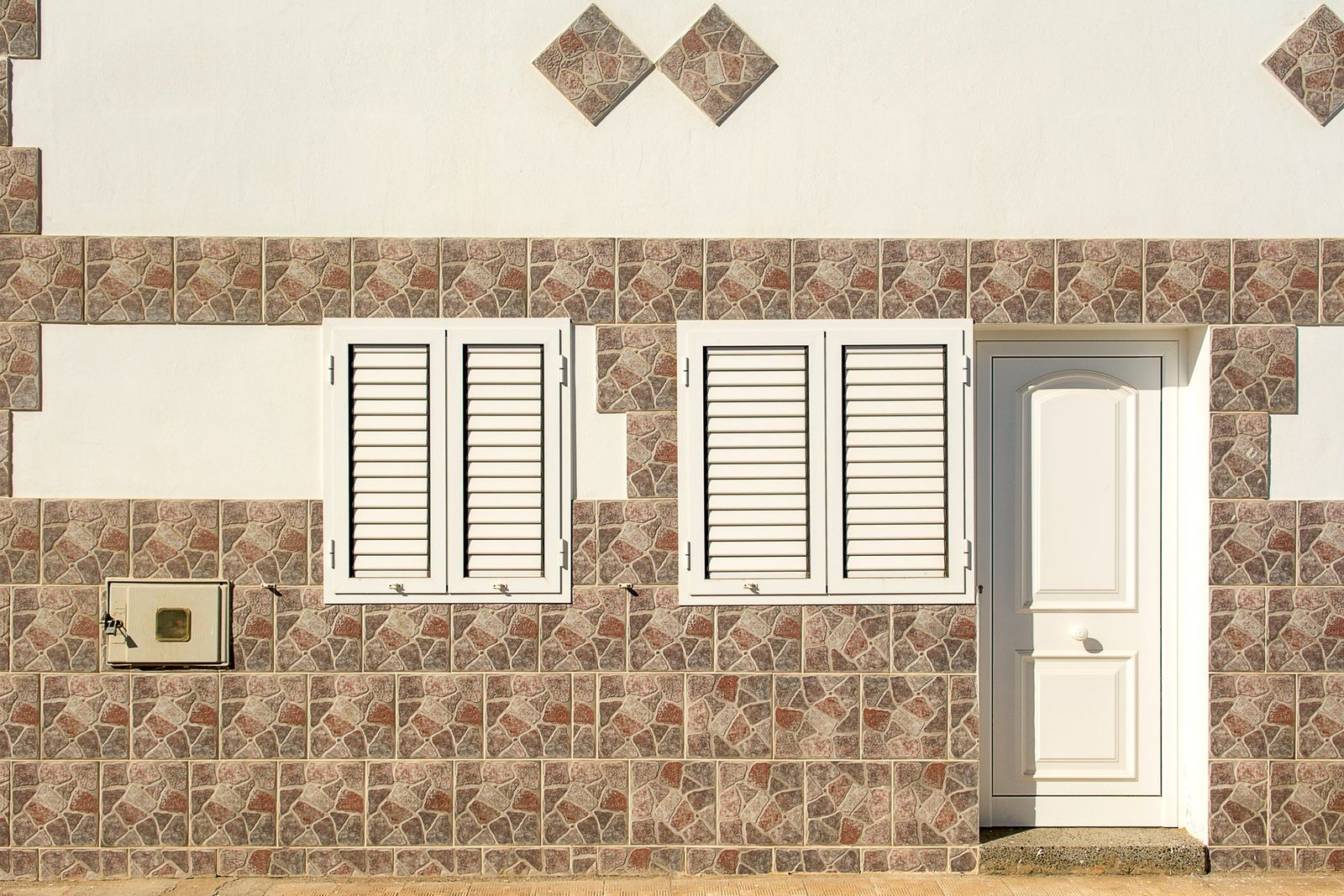 entrance door with matching frame and hardware finish