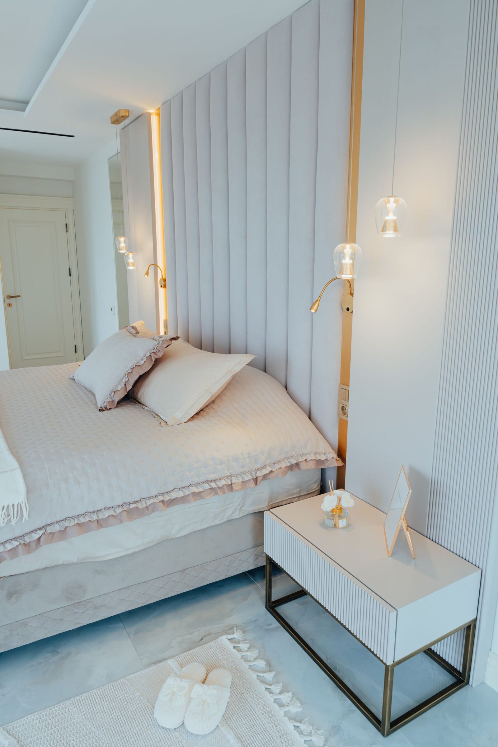 White panelled headboard with slim nightstand