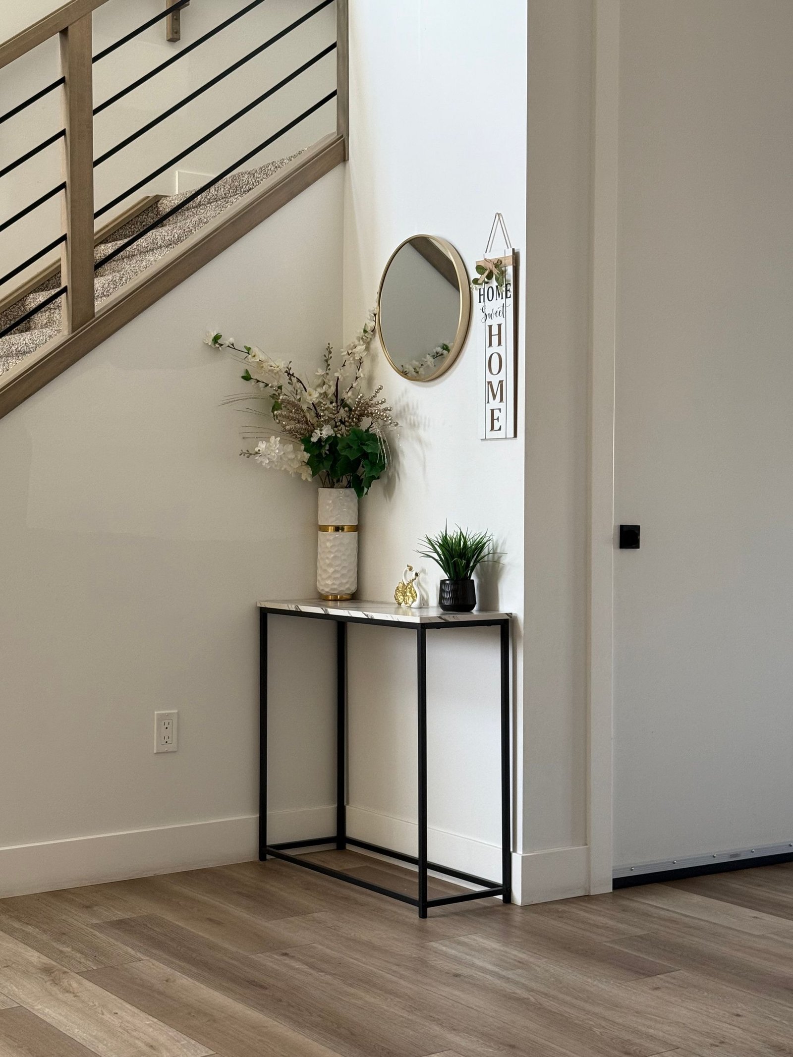 Minimal entry console with round mirror