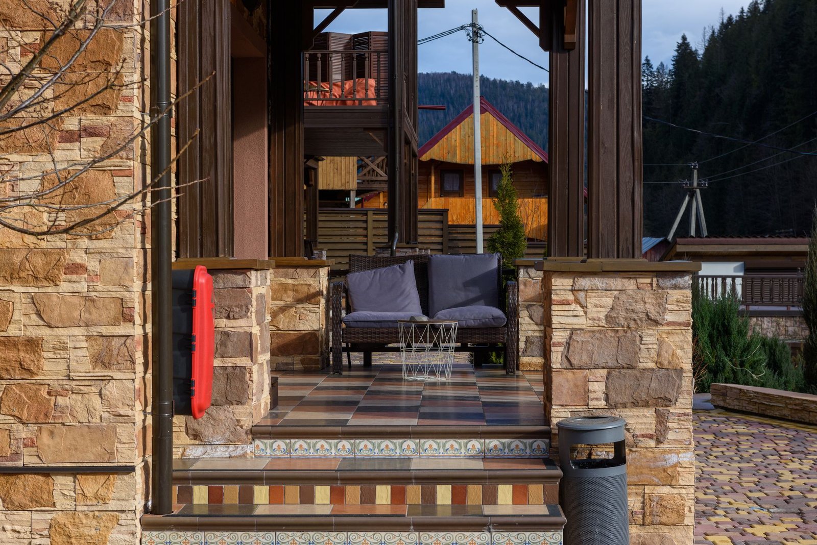 Stone terrace with blue lounge seating