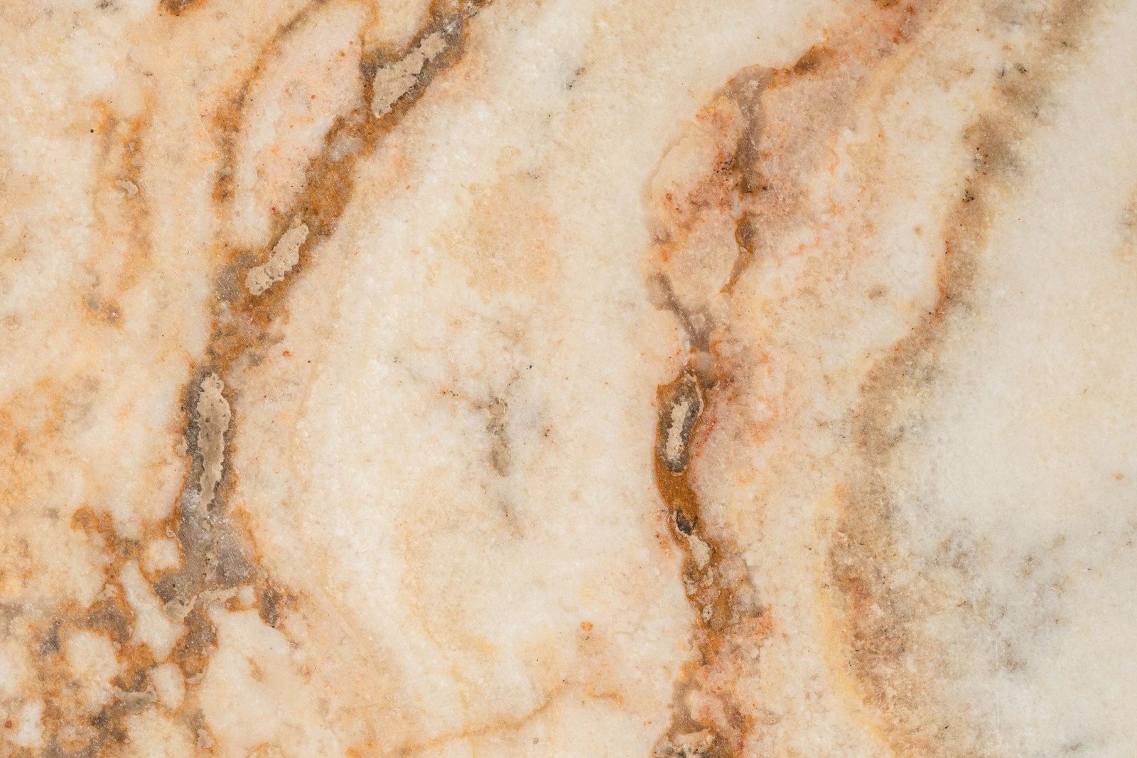 Amber and brown sintered slab with flowing band pattern