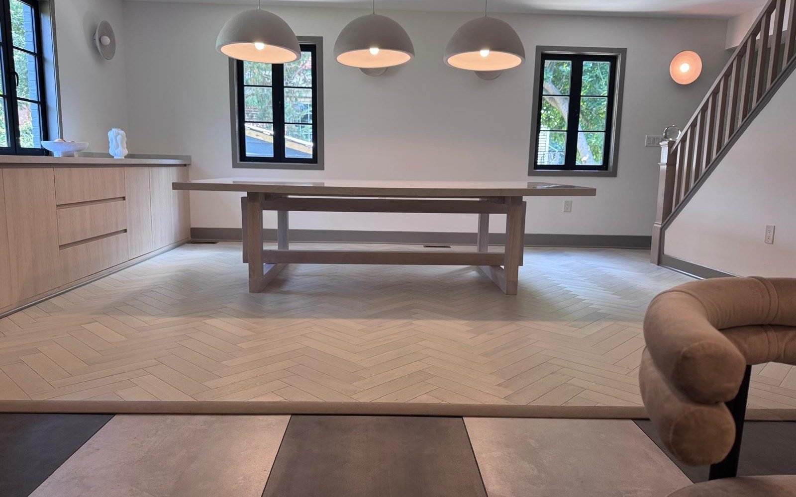 Installed dining room sideboard wall in light oak with pendant lighting in a US villa after the container arrived
