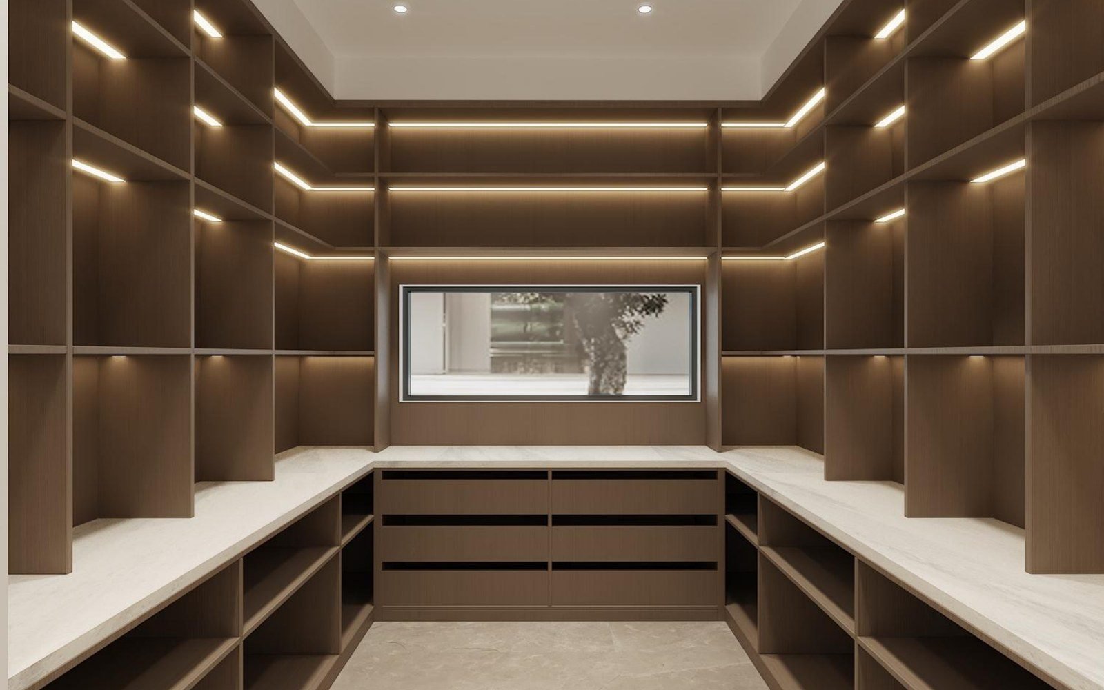 U-shaped walk-in pantry with floor-to-ceiling shelving, a central drawer bank and a stone counter in a villa
