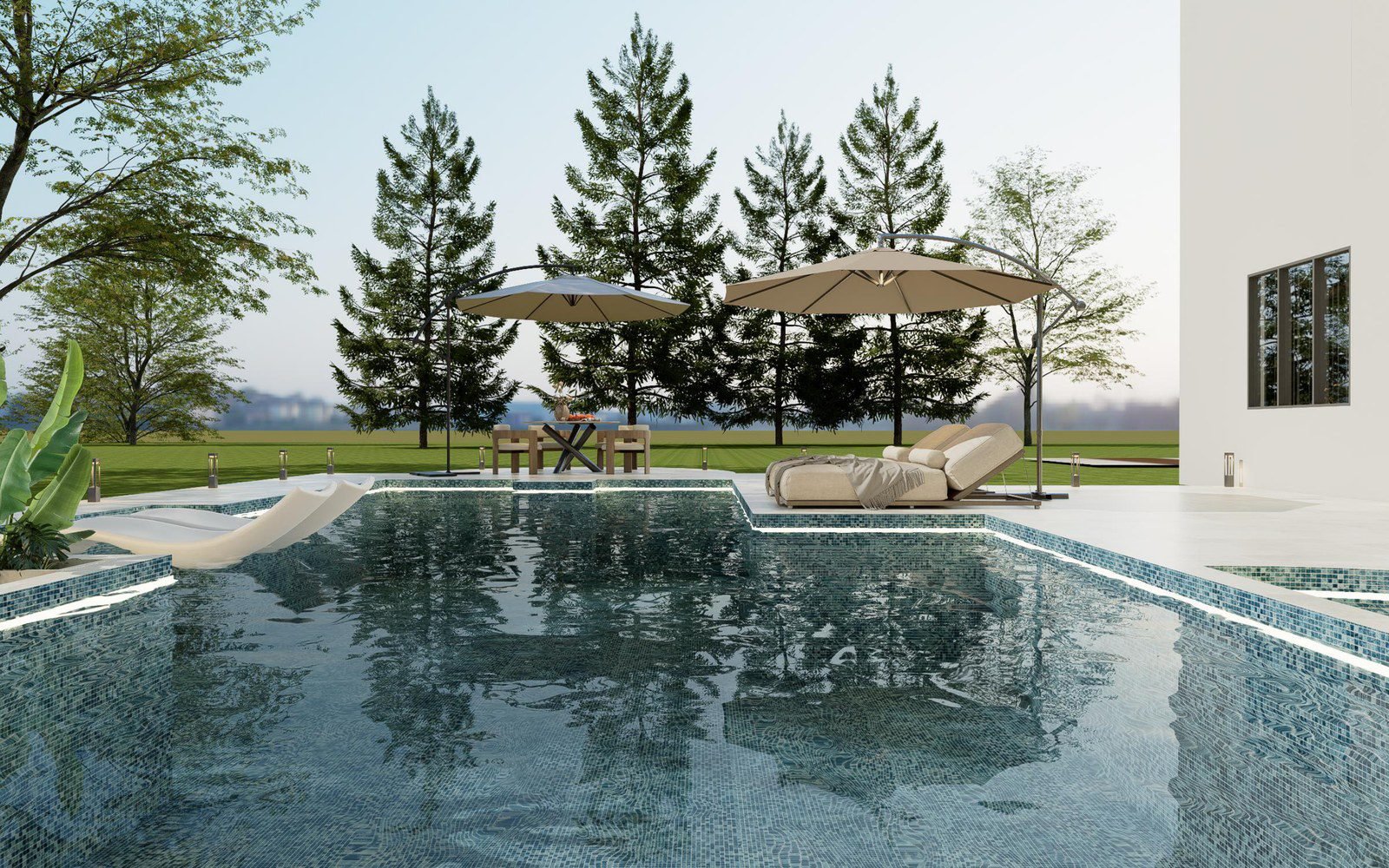 Villa pool at the deck edge with the loungers and umbrellas; the plunge pool is the small end of this water feature family