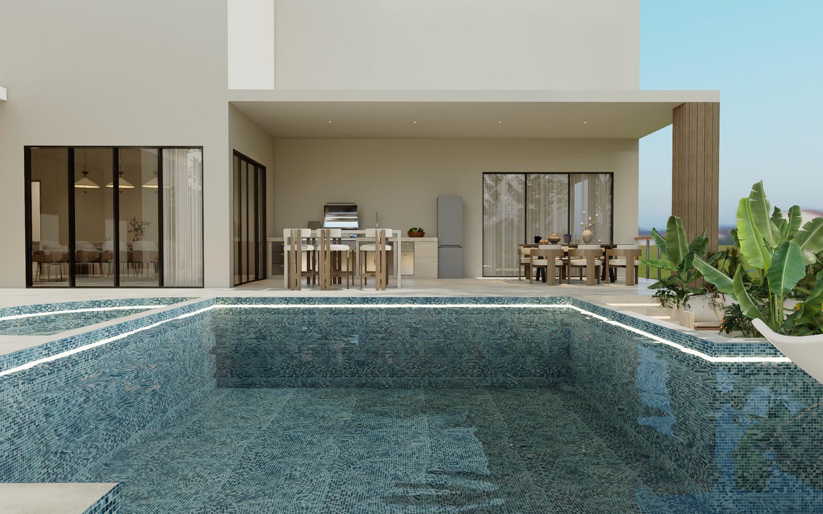 The coping line where the deck meets the water; the edge a plunge pool shares with the full pool it comes from